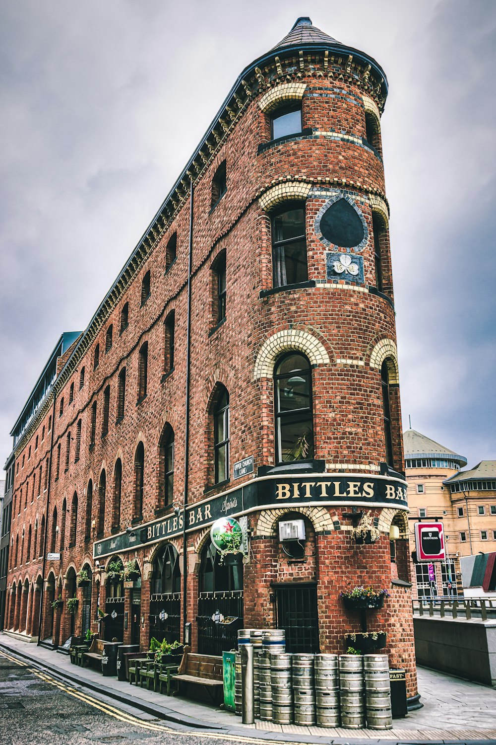 brown brick building under cloudy sky during daytime