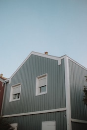 white and red wooden house under blue sky during daytime