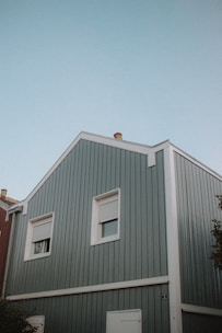 white and red wooden house under blue sky during daytime