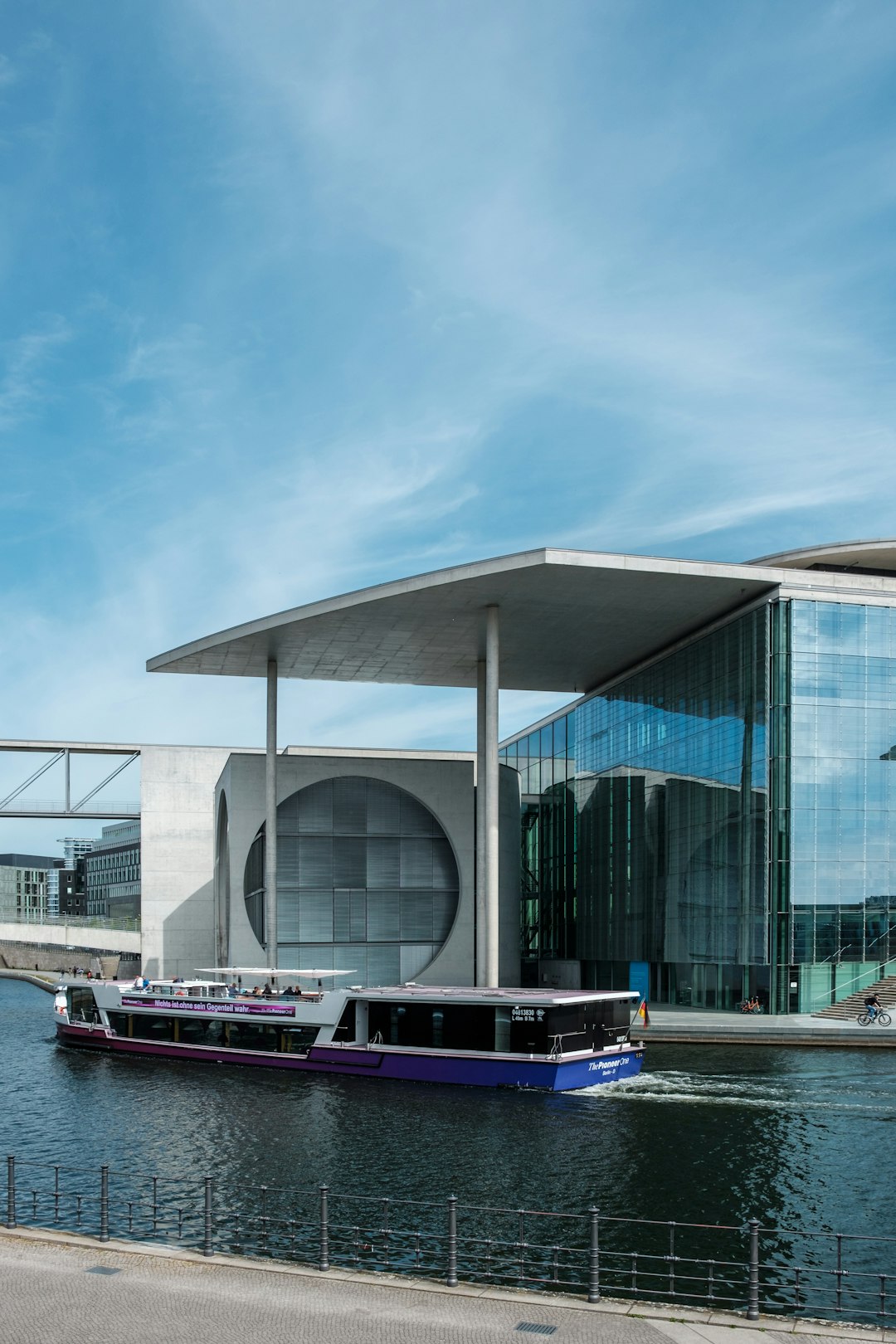 white and blue building near body of water during daytime