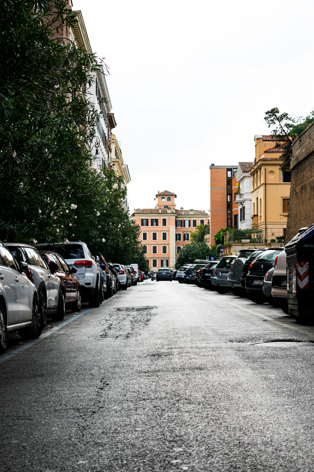 cars parked on the side of the road during daytime