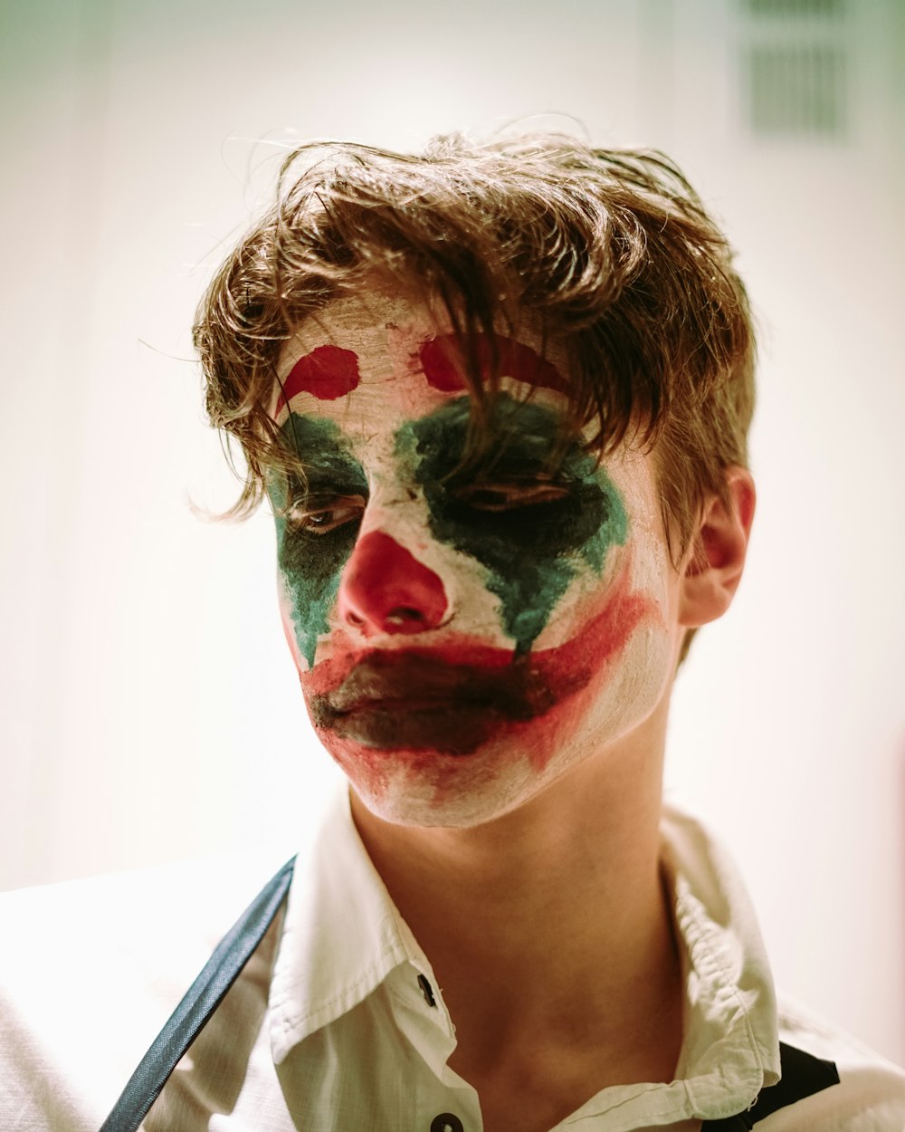 woman with red and green face paint