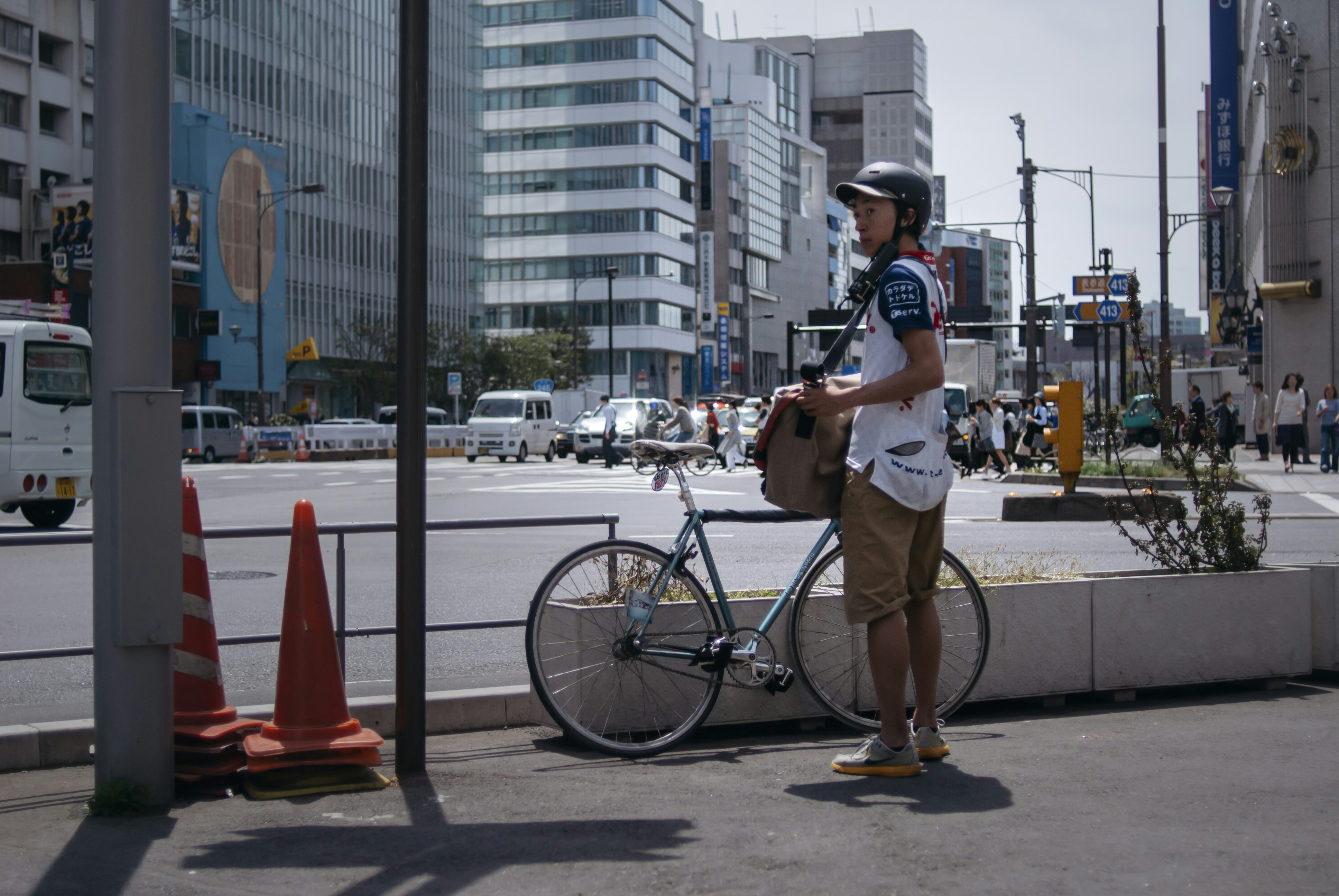 rows of bicycles neatly parked in an organized Japanese bicycle parking facility near a train station in Tokyo