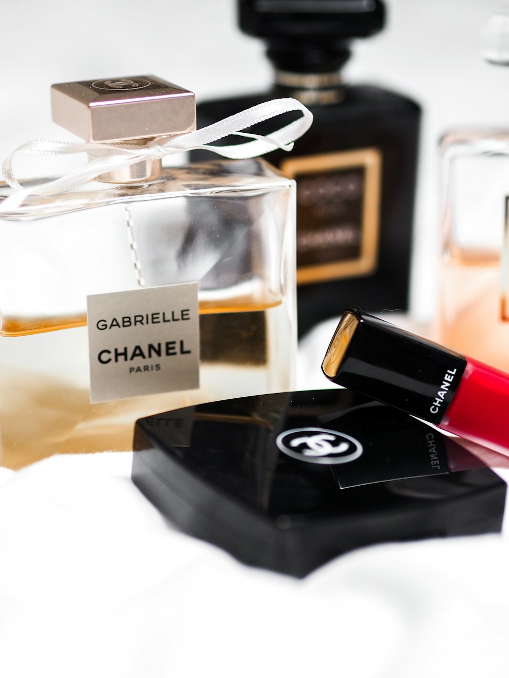 a bottle of chanel perfume next to other bottles