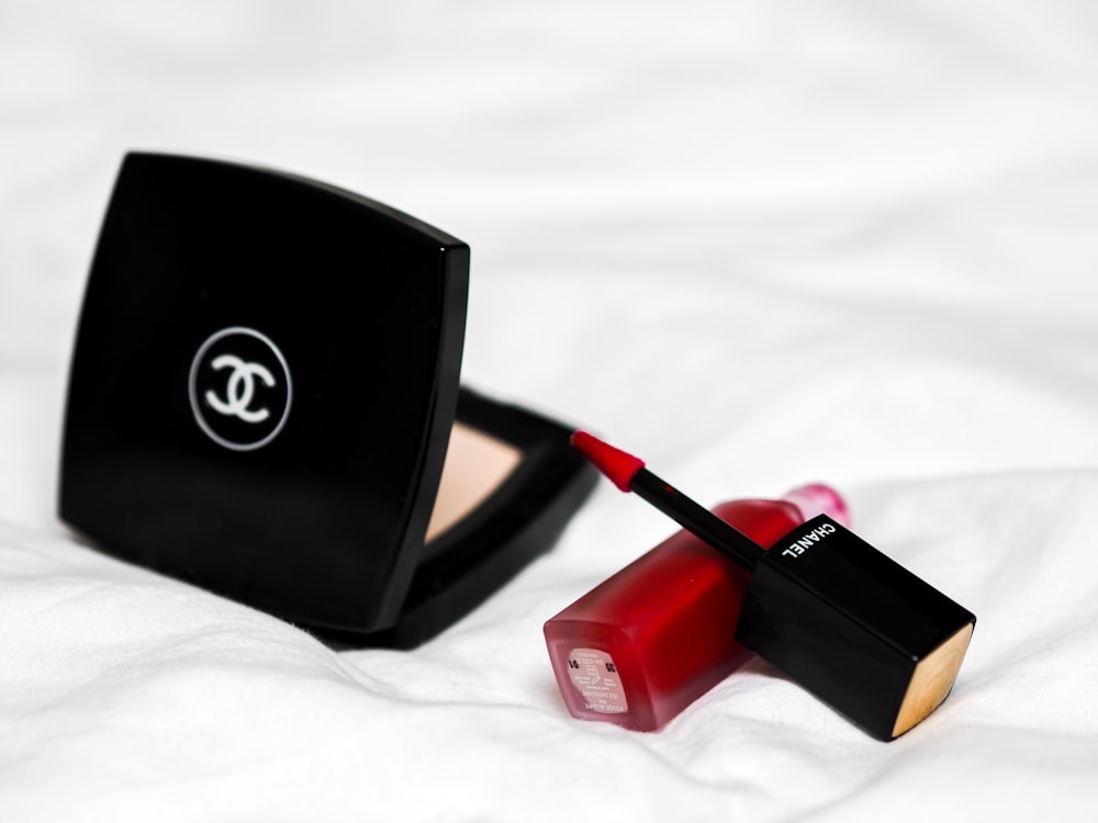 red lipstick beside black box