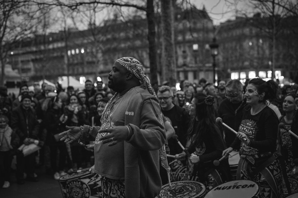 grayscale photo of man playing musical instrument