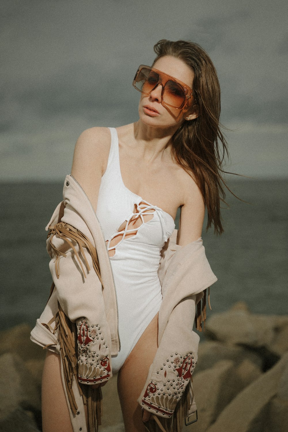 woman in white tank top wearing sunglasses