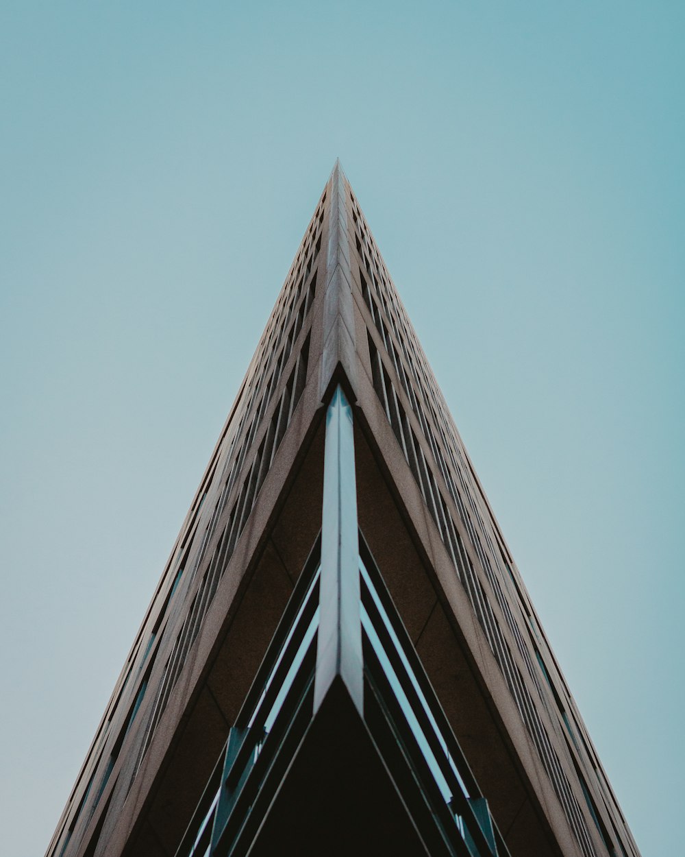 brown concrete building under blue sky during daytime