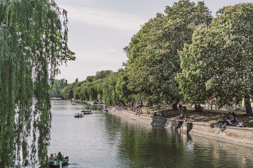 people riding on boat on river during daytime