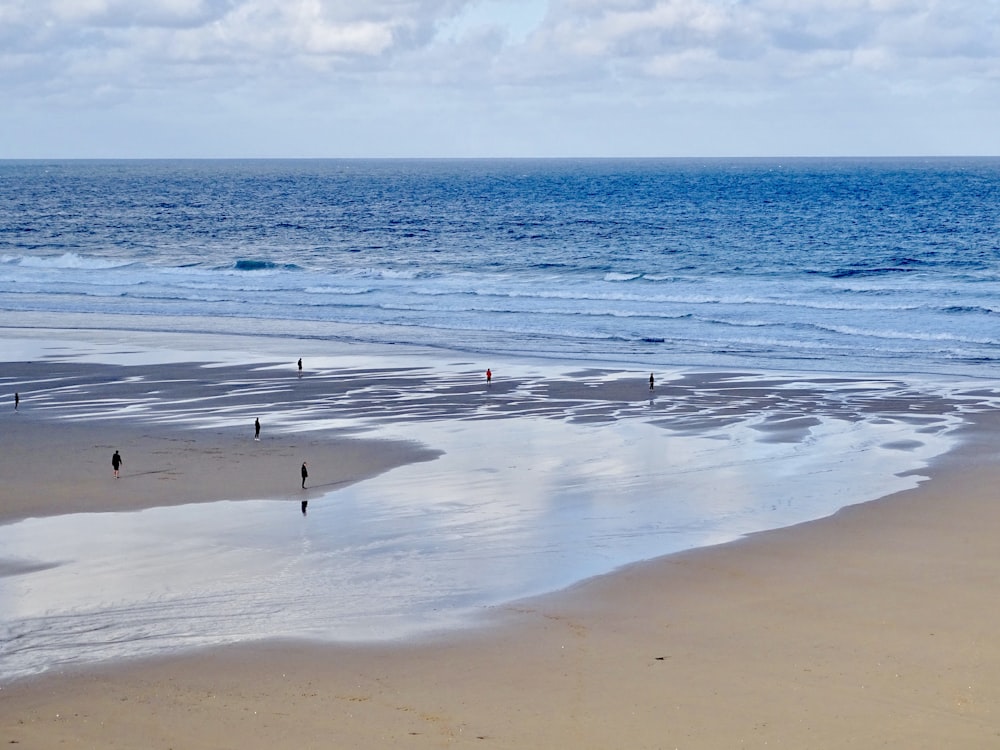 person walking on beach during daytime