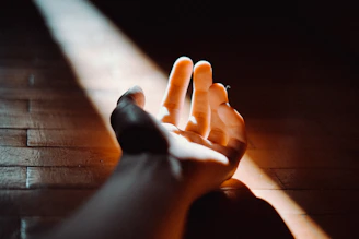 persons feet on brown wooden floor