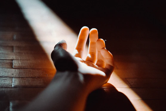 persons feet on brown wooden floor