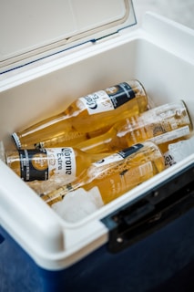 yellow labeled bottle in white plastic container