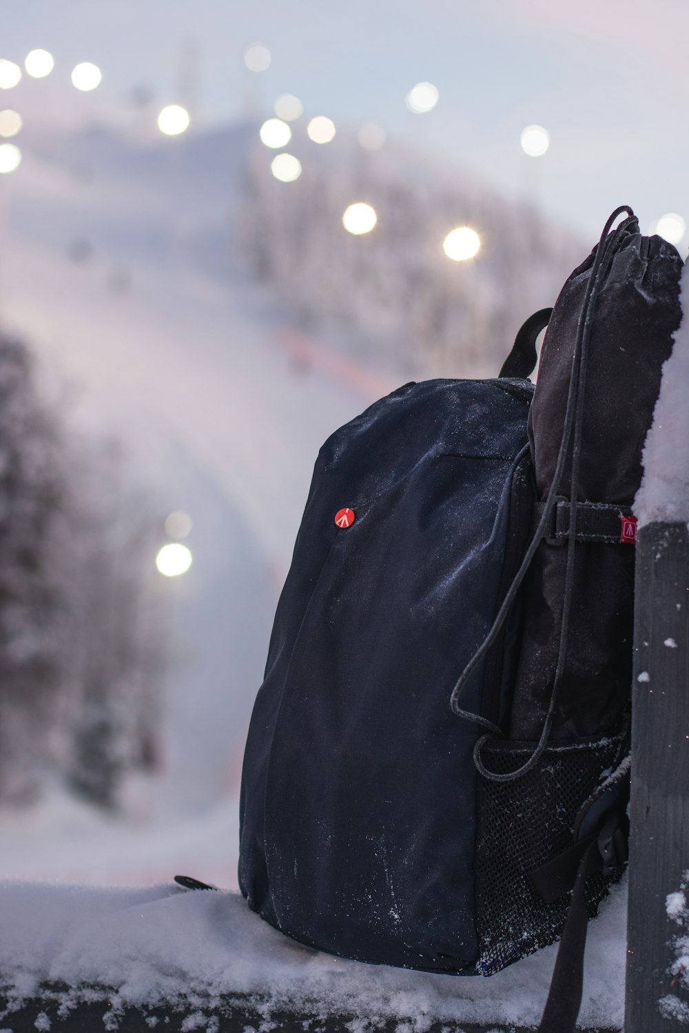 person in black jacket with black backpack