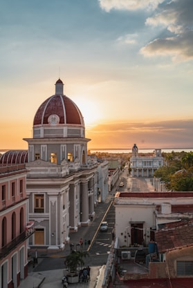 white and brown concrete building during sunset
