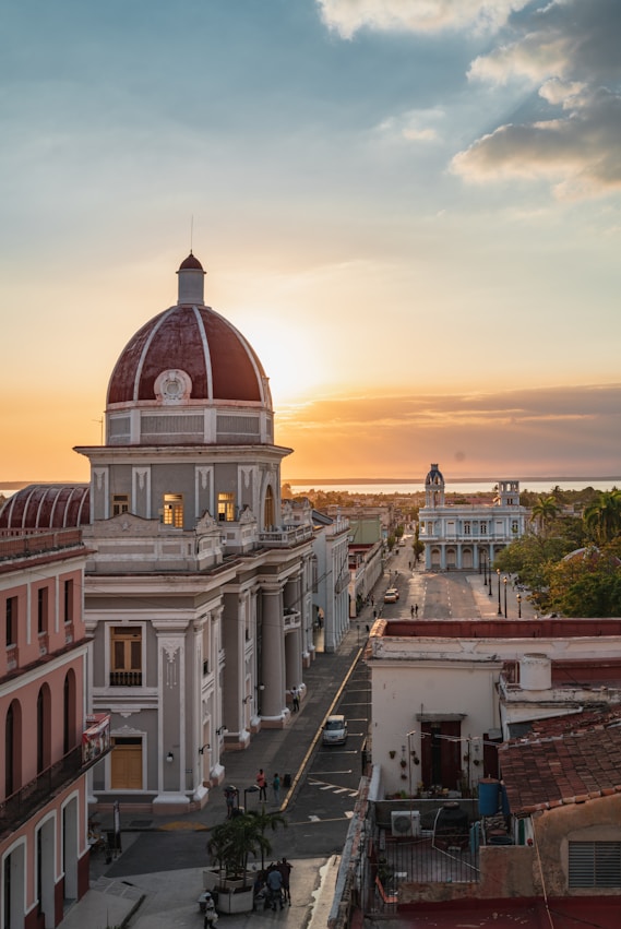 white and brown concrete building during sunset