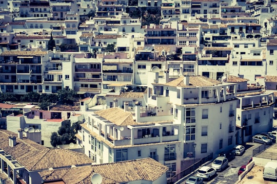 white and brown concrete buildings during daytime in Mijas Spain