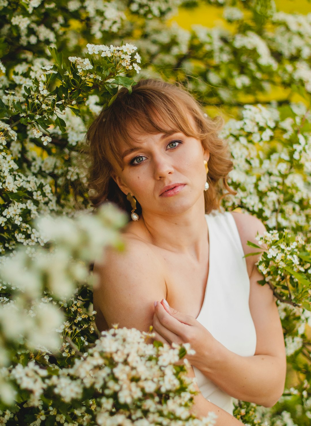 woman in white sleeveless dress