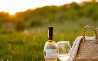 clear glass bottle on brown wooden table during daytime