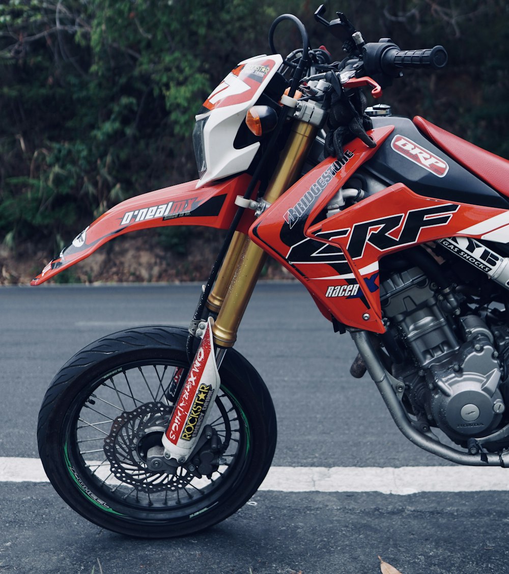 orange and black honda motorcycle