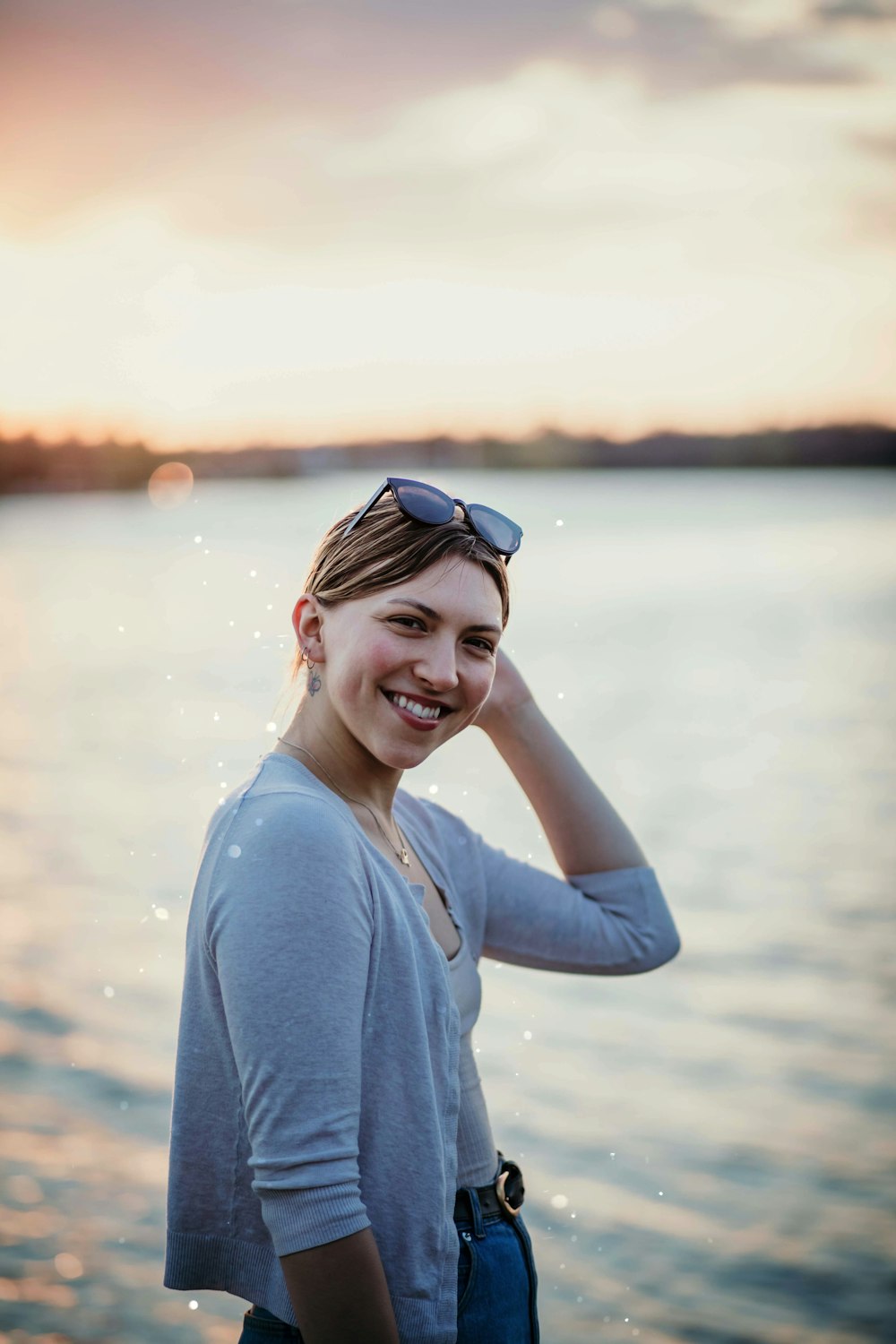 woman in blue long sleeve shirt wearing blue sunglasses