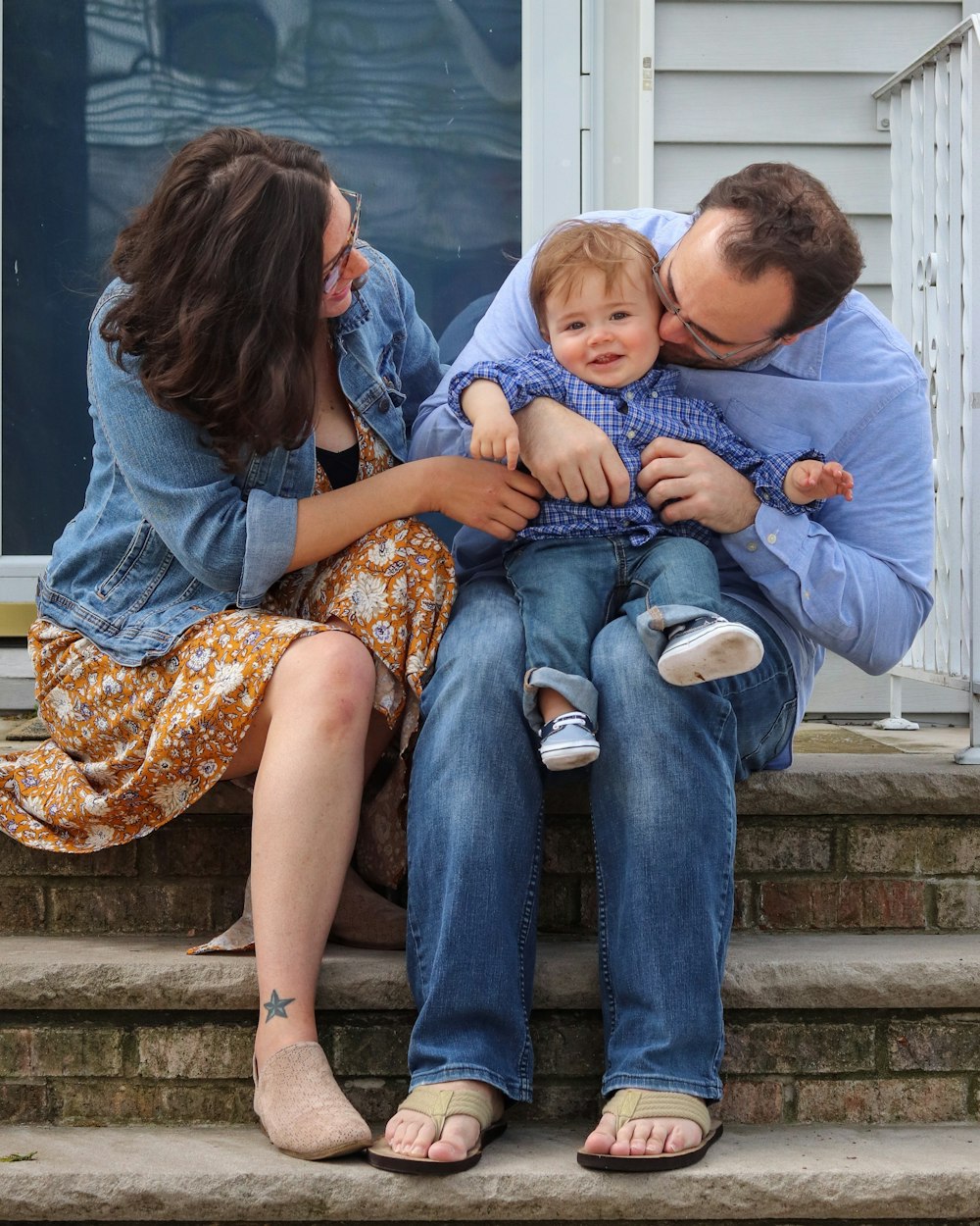 man in blue denim jeans sitting beside woman in blue denim jeans