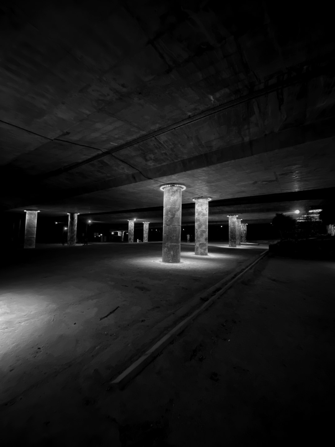 grayscale photo of a parking lot