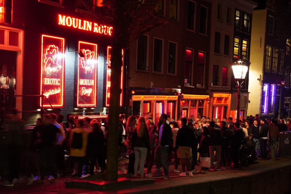 people walking on street during night time