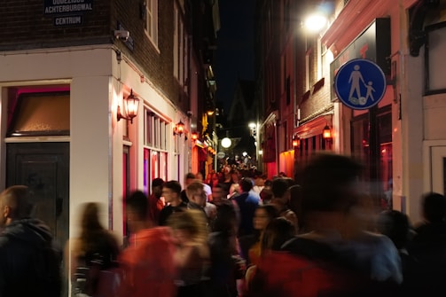 people walking on street during nighttime