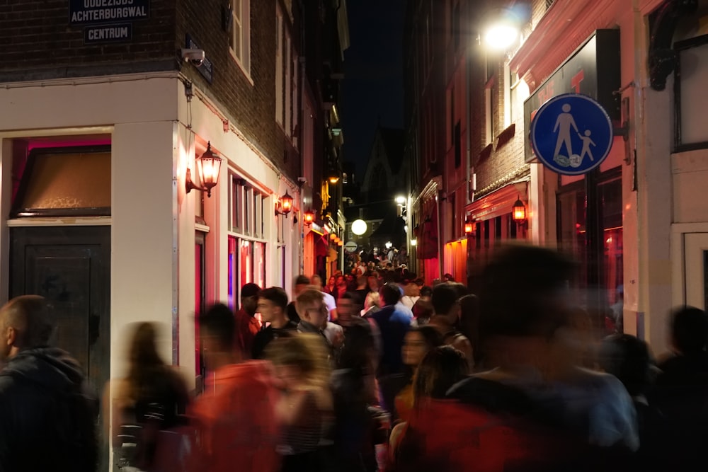 people walking on street during nighttime