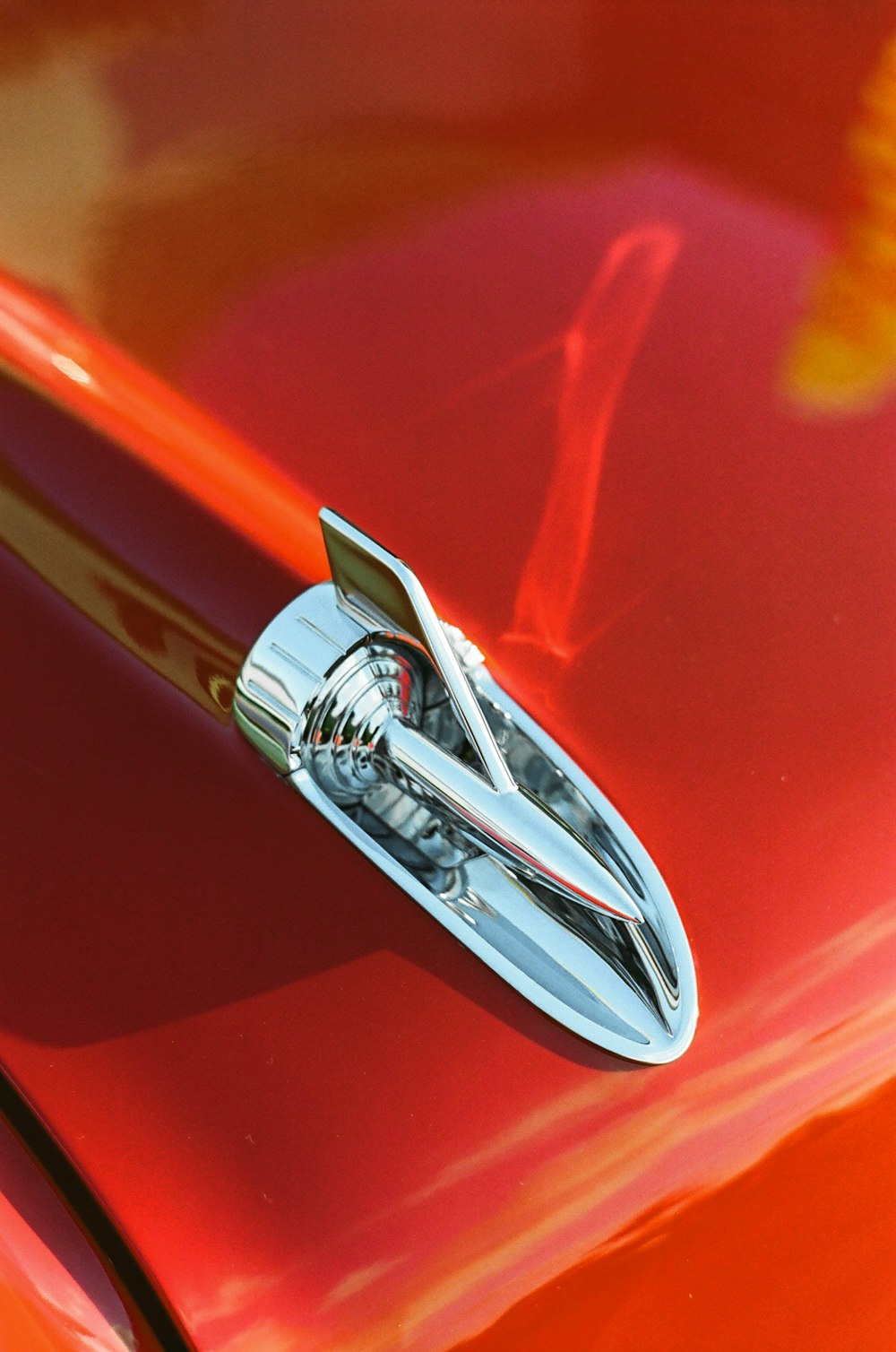 red and silver car door handle
