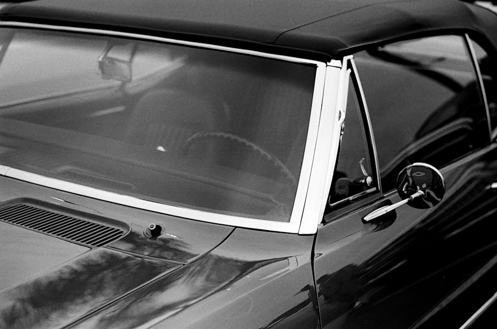 grayscale photo of car door