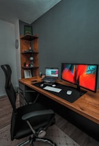 A modern office desk featuring a computer screen displaying a vibrant business website.