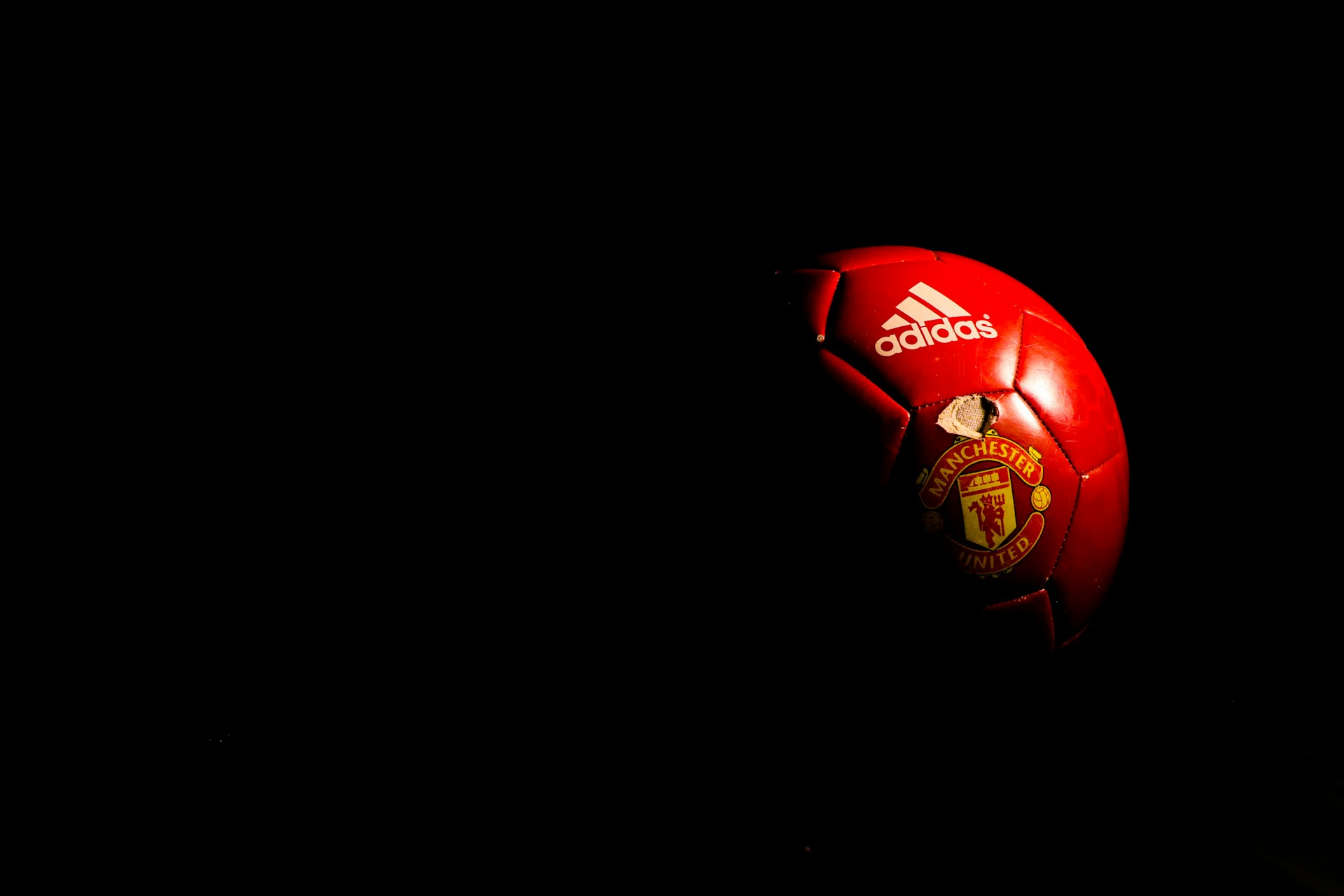 red and black soccer ball