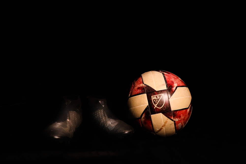 red and black soccer ball