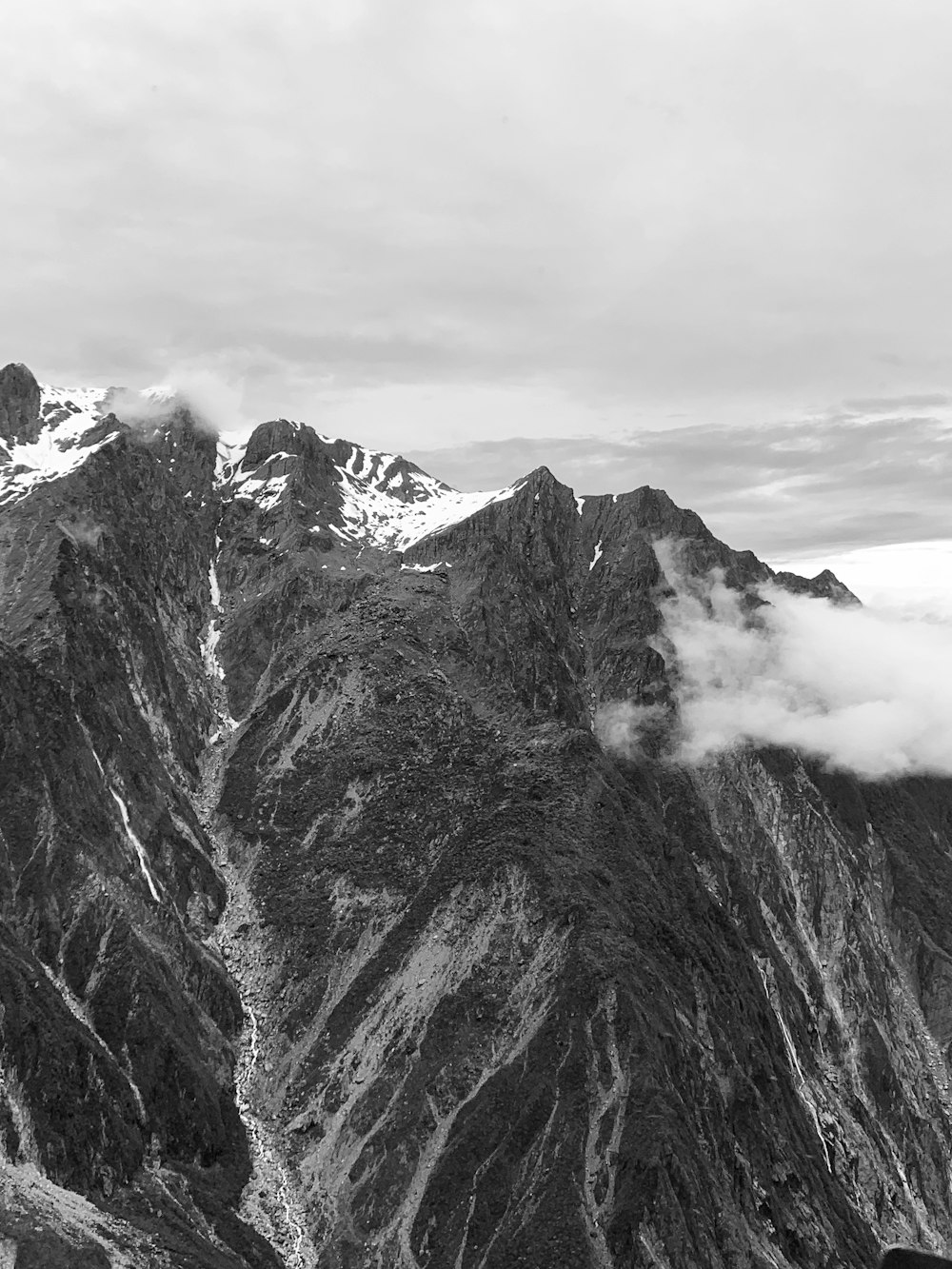 grayscale photo of mountain range