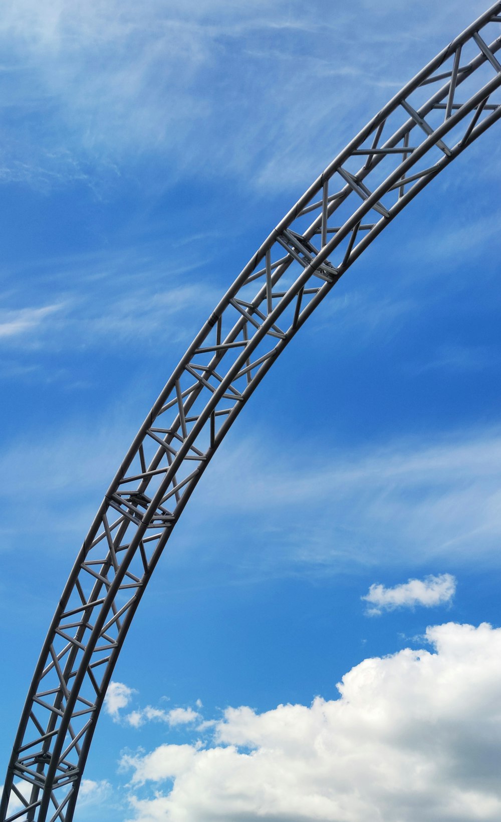 gray metal tower under blue sky