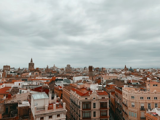 brown and white concrete buildings under white clouds during daytime in Torres De Serrano Spain