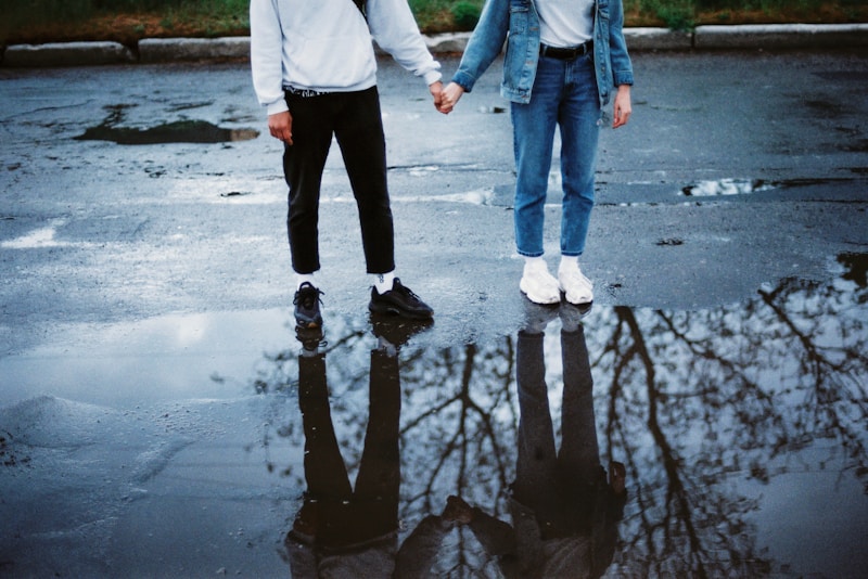 Couple standing on wet street