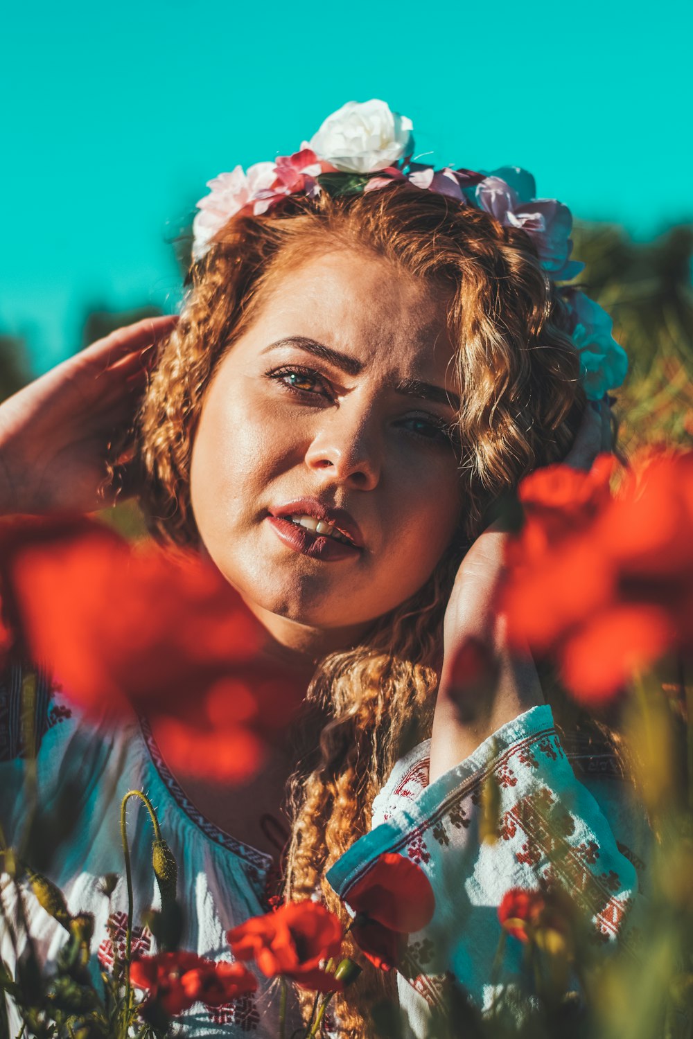 woman in blue and white floral dress