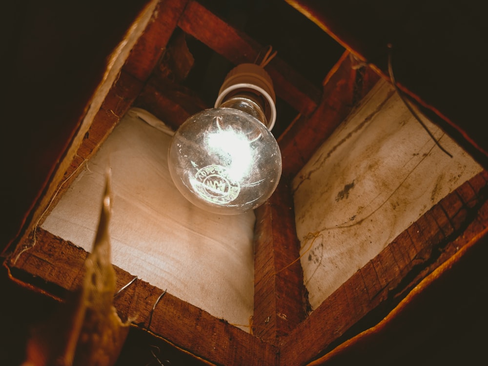 clear glass ball on brown wooden table