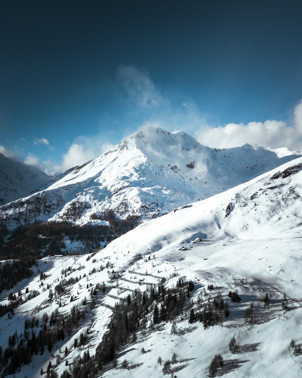 snow covered mountain under blue sky during daytime