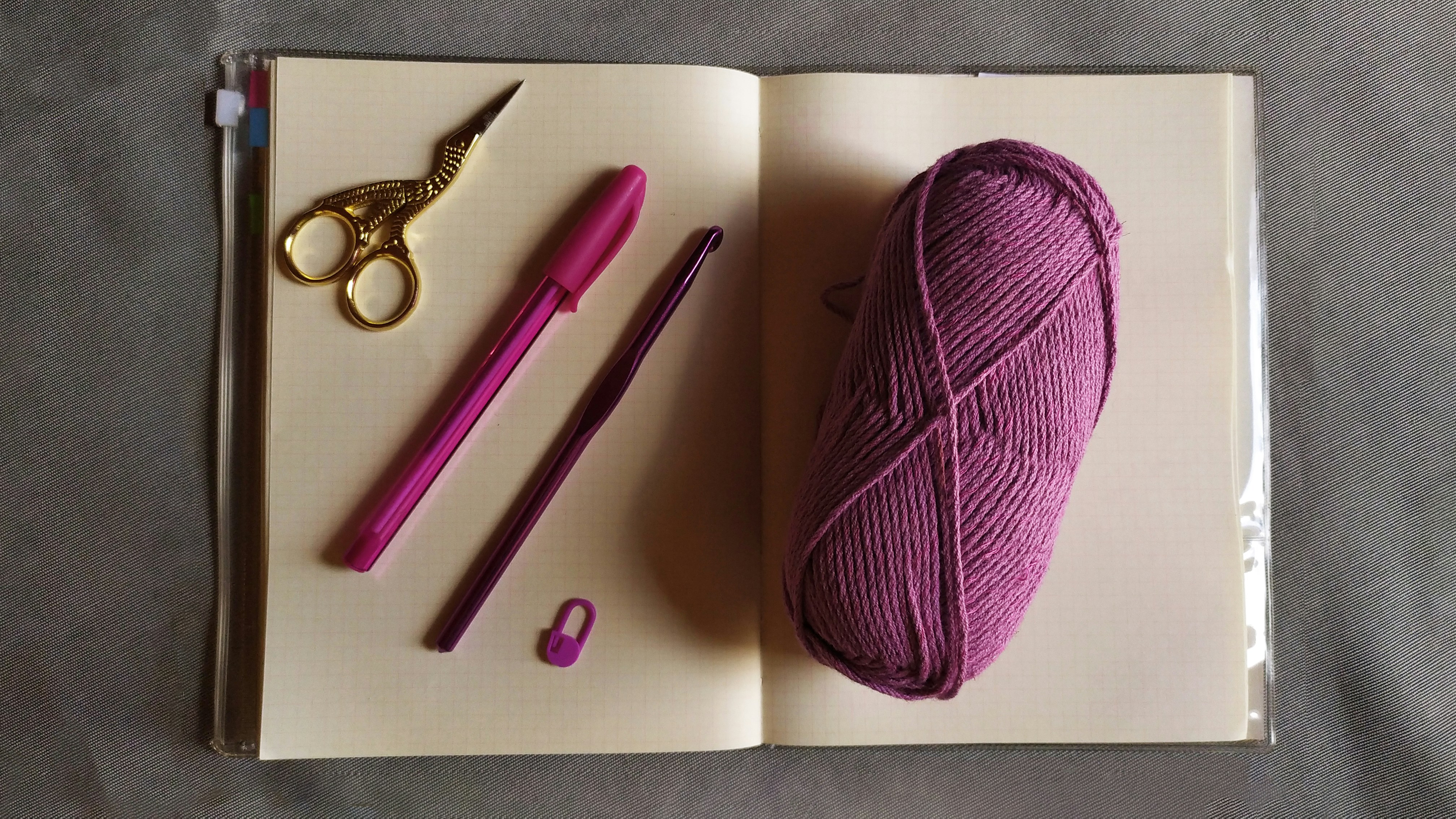 Yarn and notebook for taking notes.