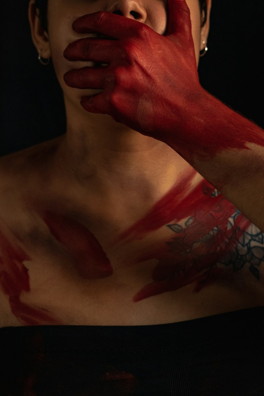 person with red paint on his body