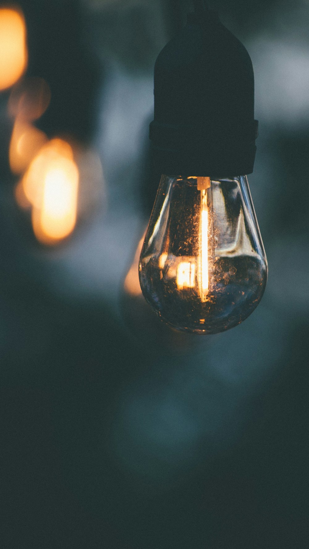 clear glass light bulb turned on during night time