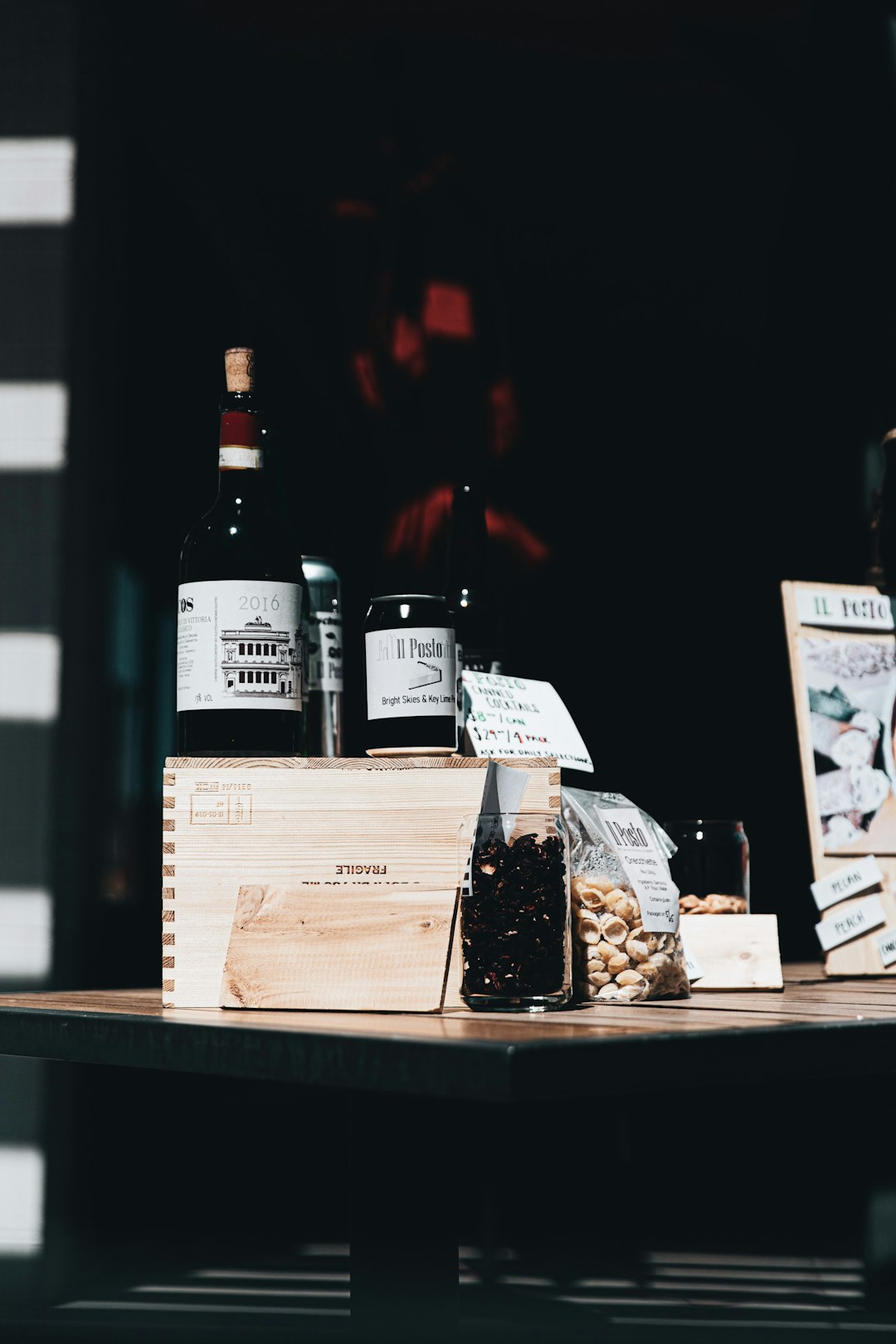 black glass bottles on brown wooden table