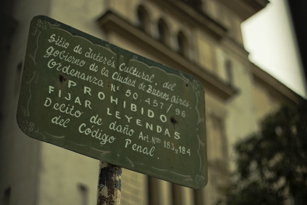 green and black wooden signage