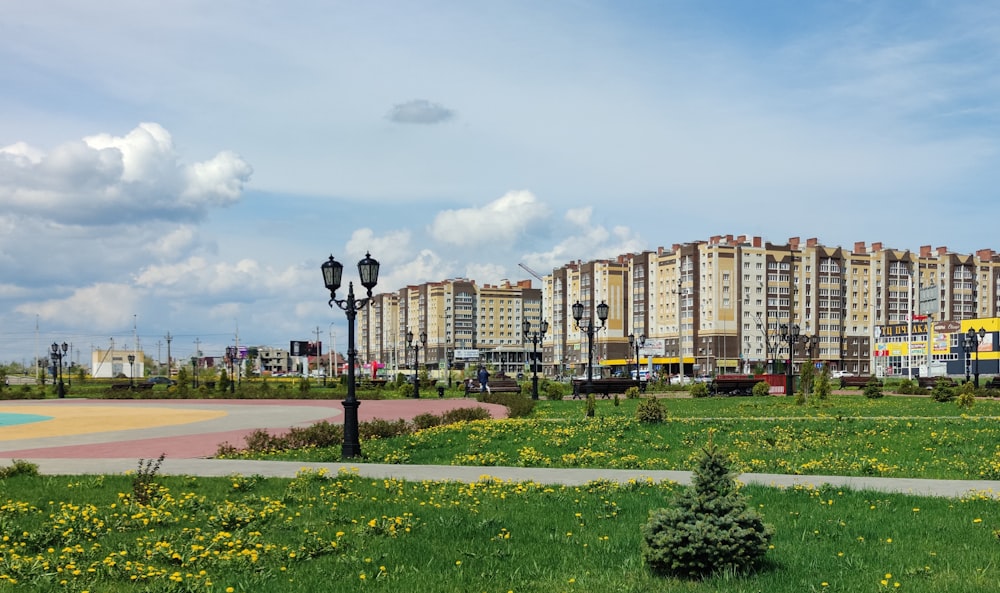 brown concrete building near green grass field during daytime