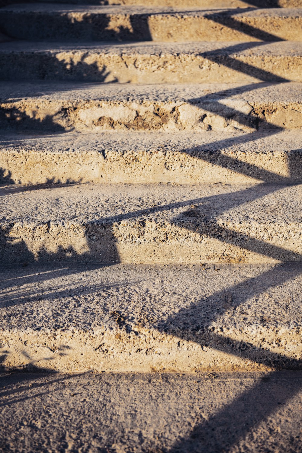 white sand with footprints during daytime