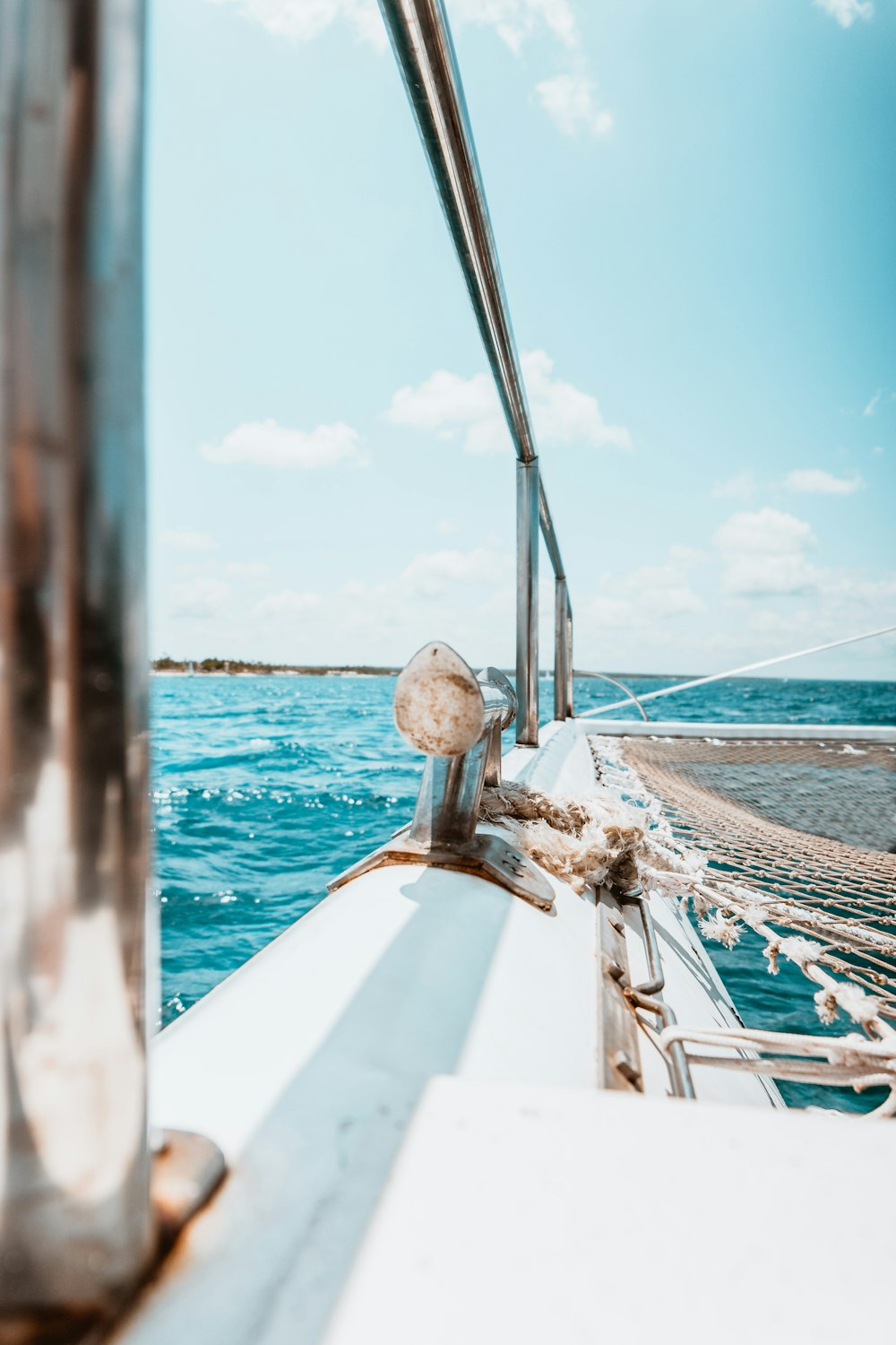 white boat on sea during daytime